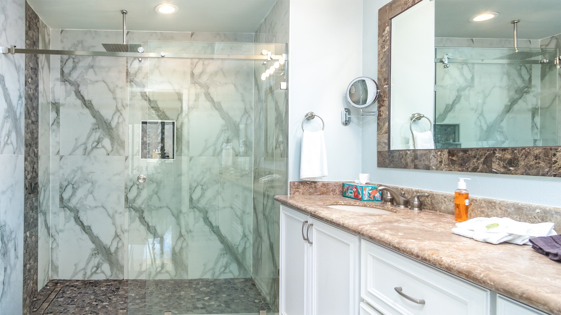 Master bath with glass enclosed shower.