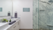 Dual vanity with large glass shower with rain shower head