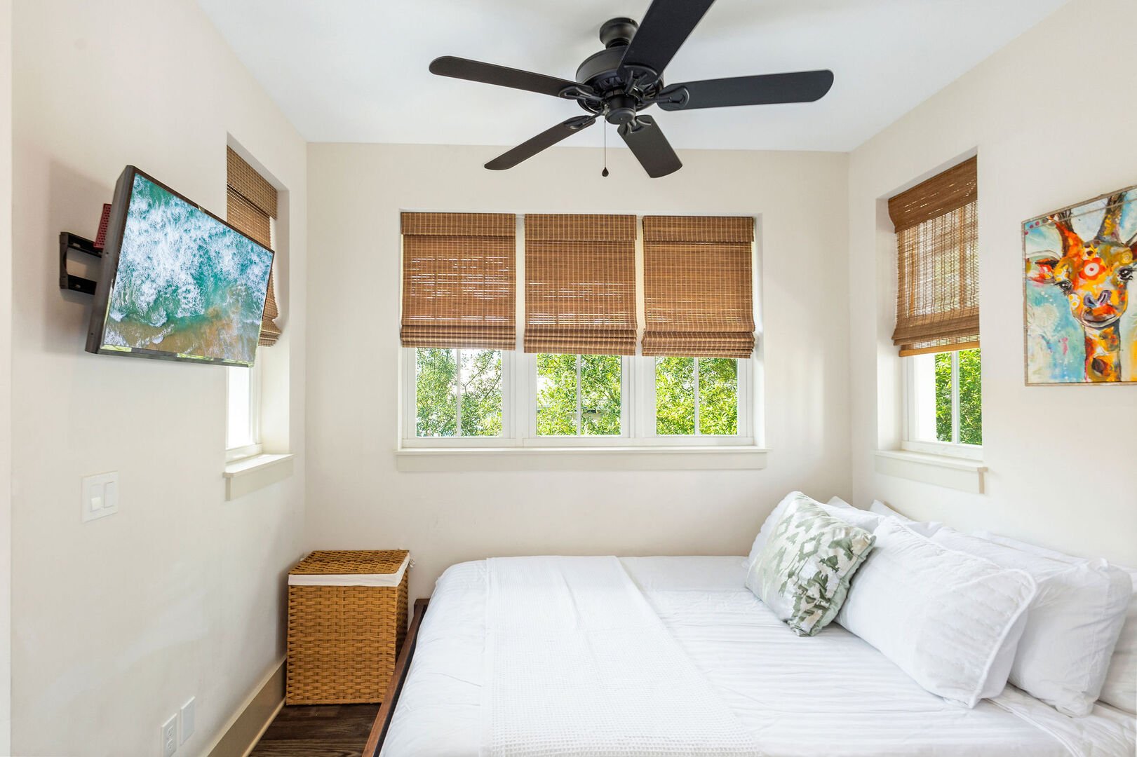 Carriage house bedroom features a queen bed, smart tv and ensuite.