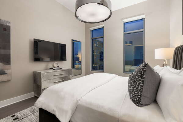 Primary suite with a king bed and a 55 4K UHD TV