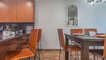 Dining table and additional seating at the kitchen counter.