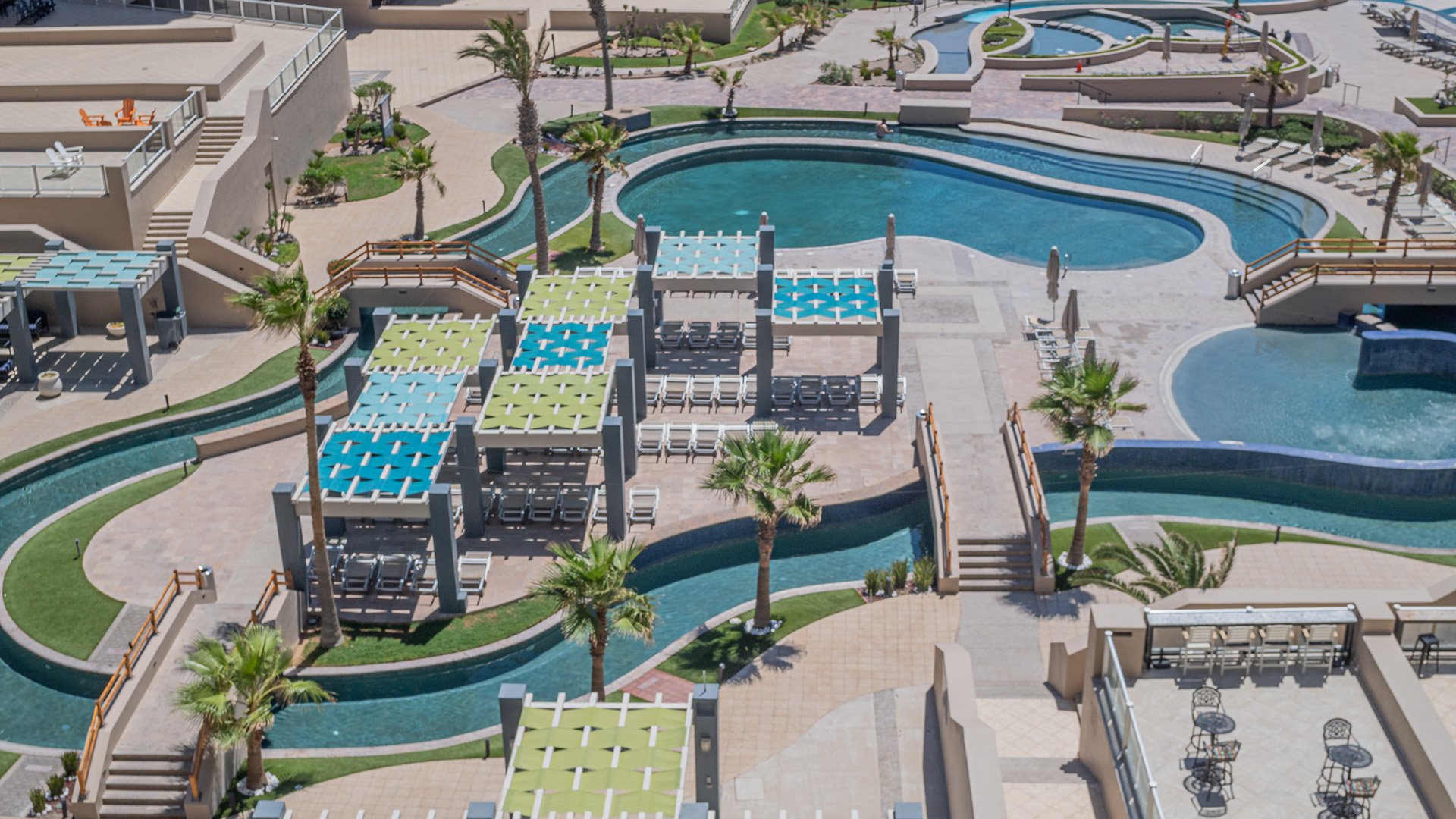 Below are lots of shaded area, pls, chaise lounge chairs, and a lazy river.