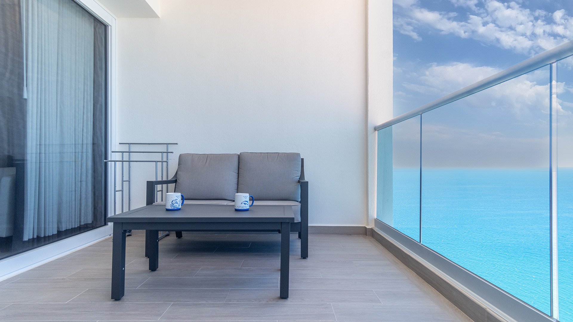 This love seat is the perfect spot on the balcony for a morning coffee.