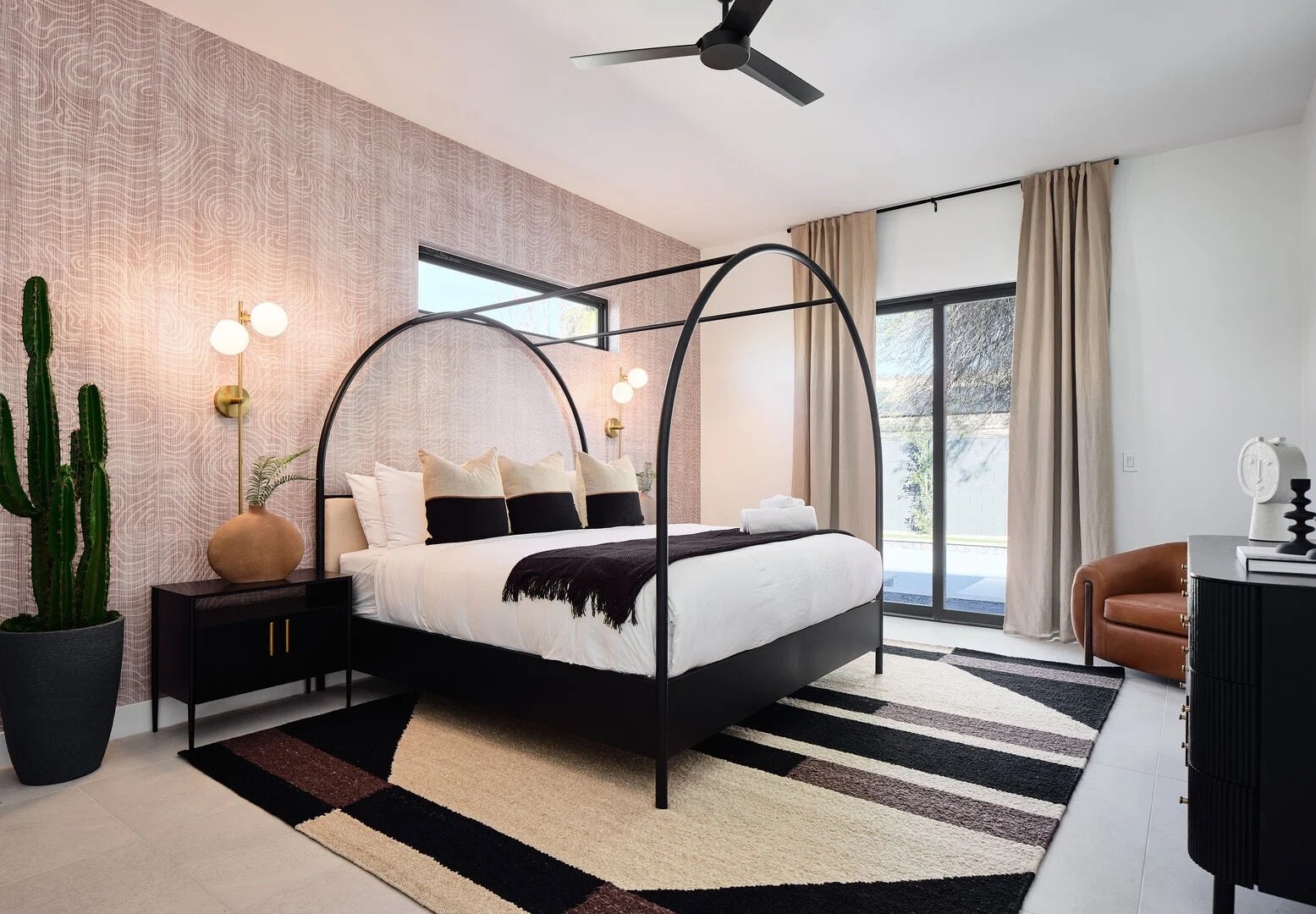 Unit 1: 2nd Bedroom featuring a King bed, a Smart TV, closet space, and an en-suite bathroom.