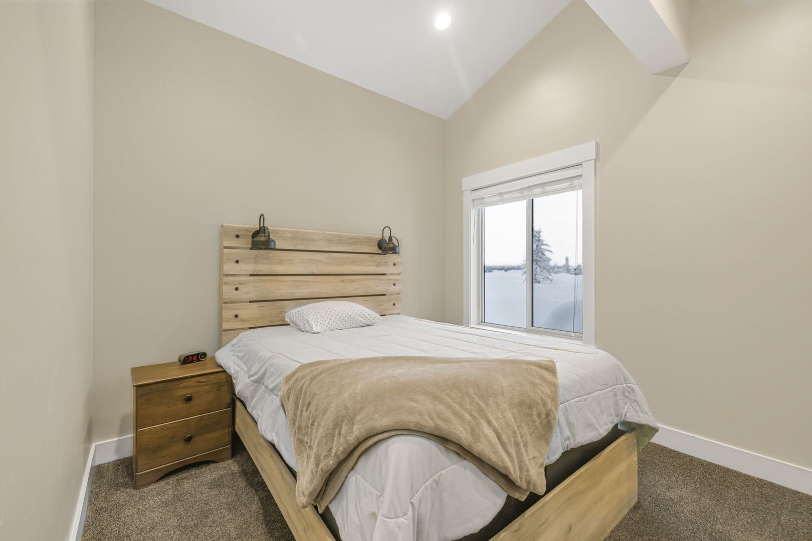 King's Retreat ~ bedroom #3 on main level w/ queen bed and shared access to full bath