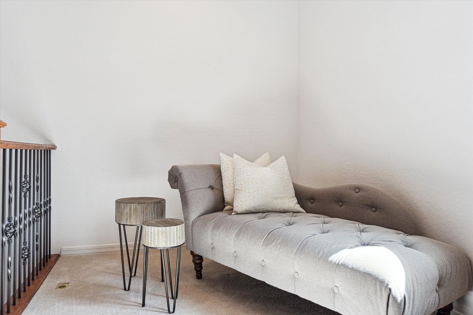Loft area with a chaise lounge chair.