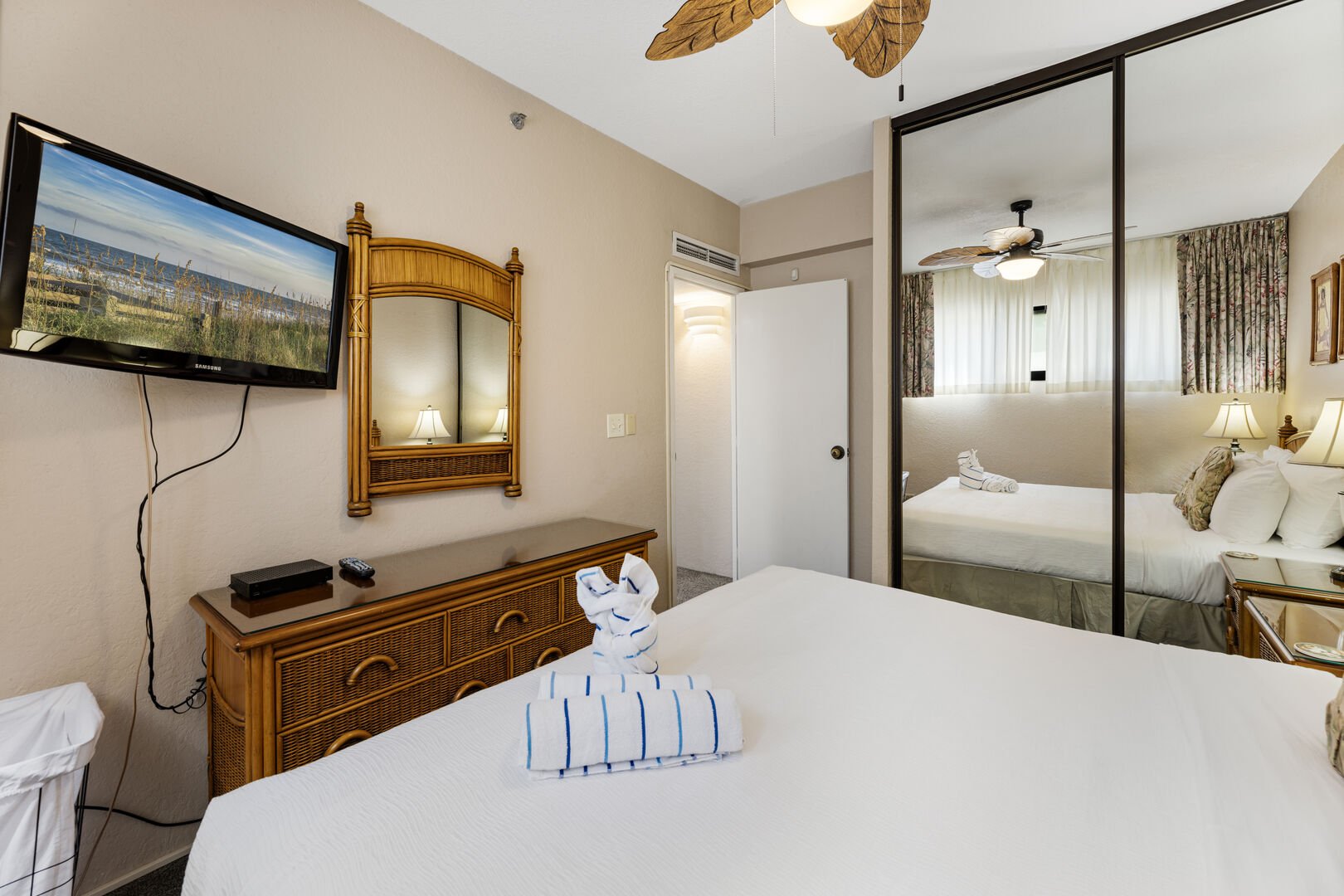 Rest easy in this cozy bedroom with island-inspired decor, a comfortable king-size bed, and a flat-screen TV. Perfect for unwinding after a day of adventure.