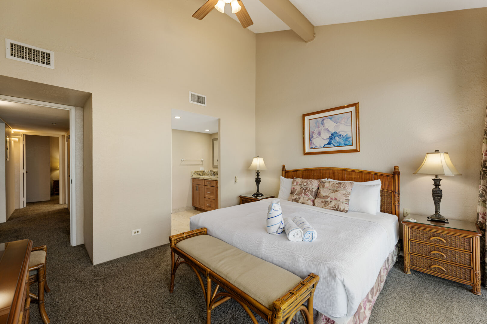 Experience ultimate comfort in this large bedroom with an en-suite bathroom. Featuring high ceilings, soft linens, and elegant decor, it's a perfect coastal retreat.