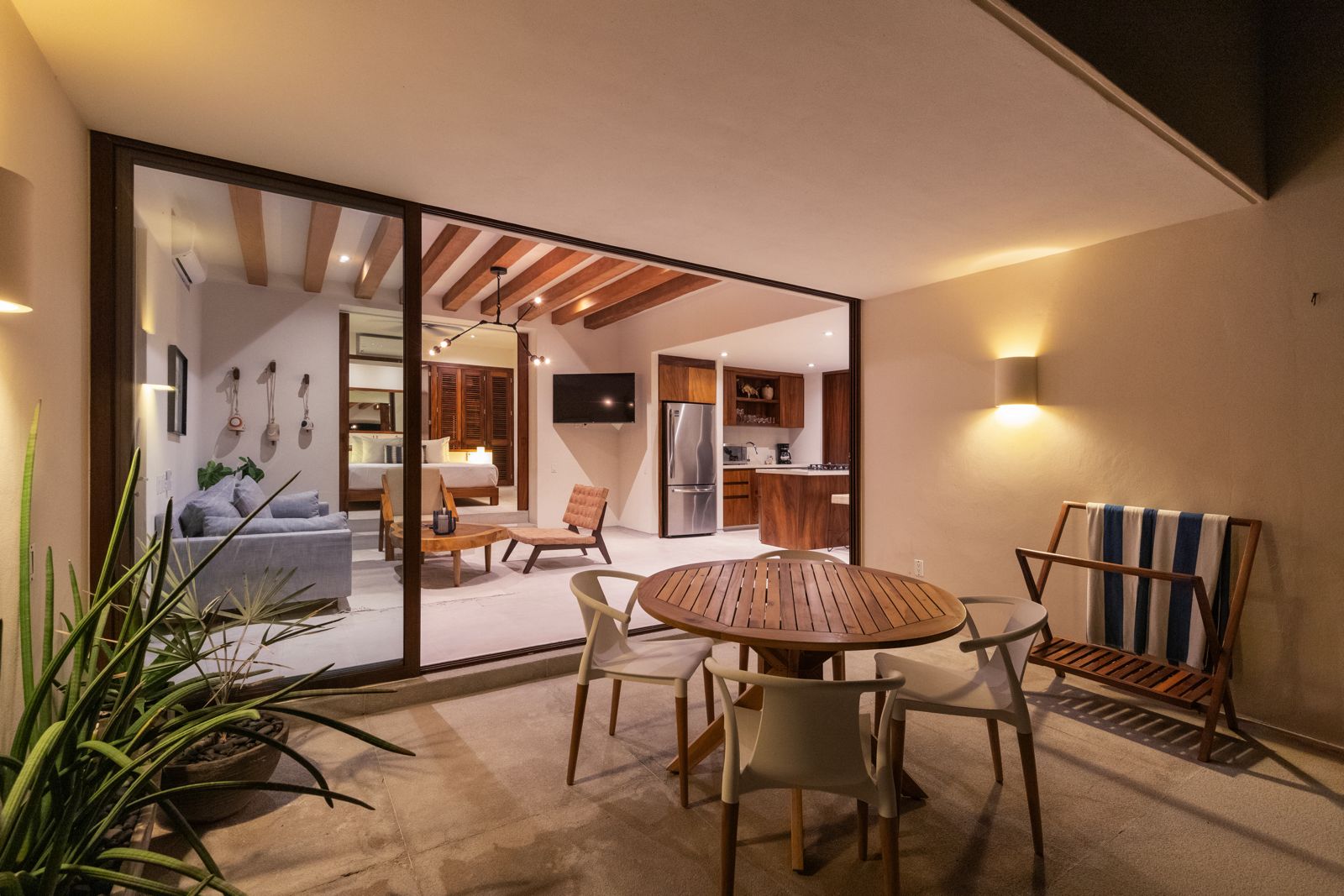 Unwind on this peaceful balcony surrounded by lush greenery, with direct access to tropical gardens and ocean vistas.