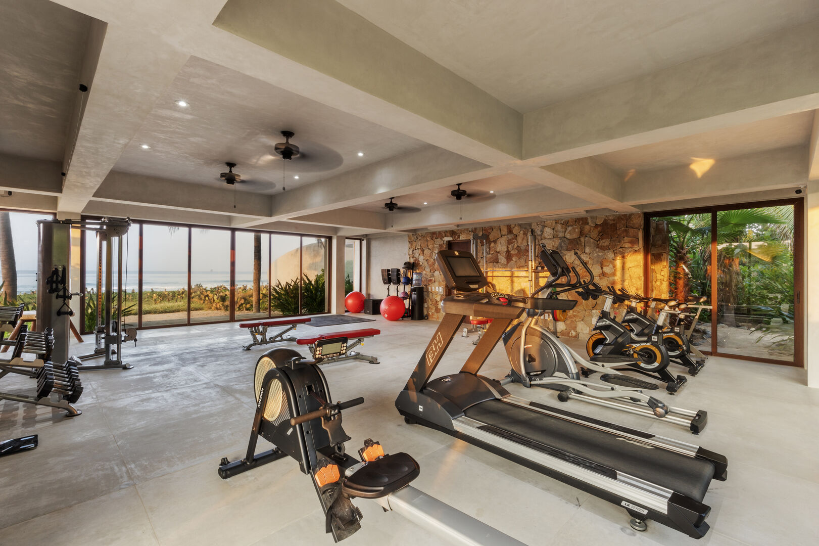 Stay active while enjoying ocean views in this spacious gym, featuring premium equipment and an open-air design.
