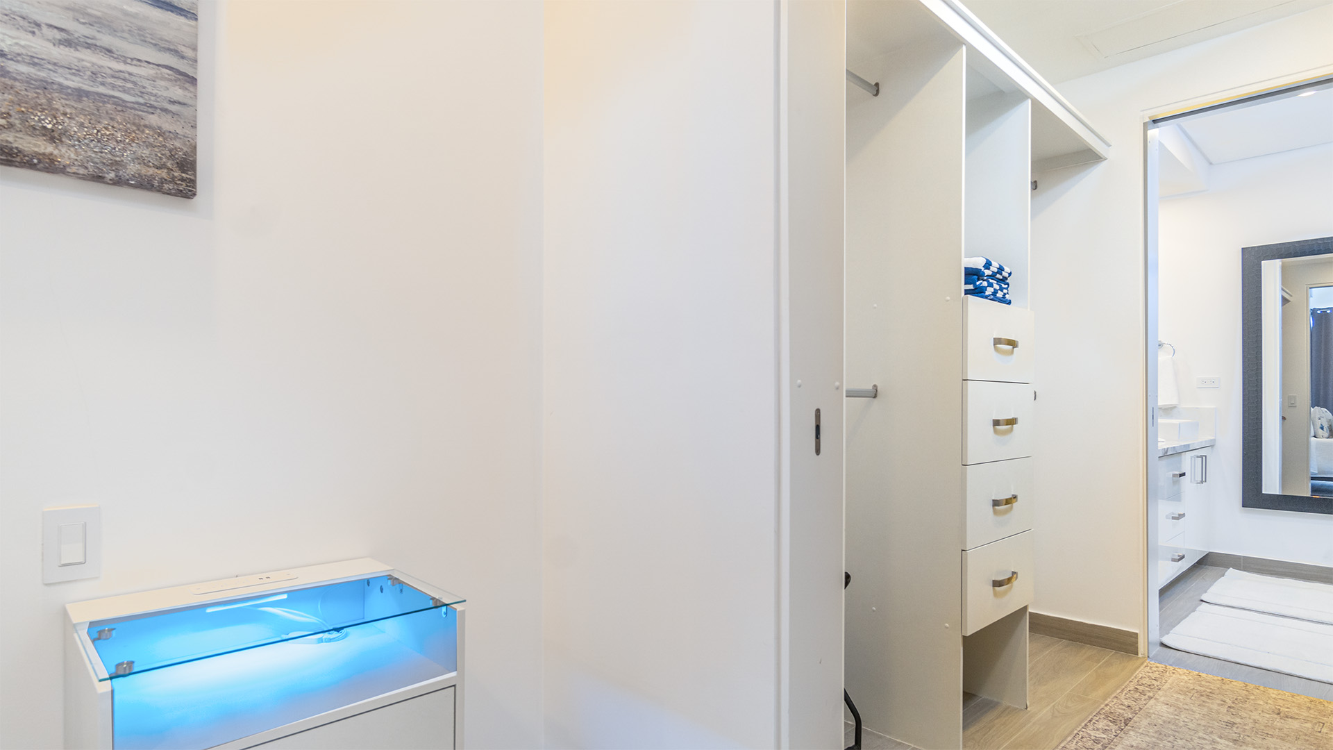 large walk-in closet between the bedroom and bathroom