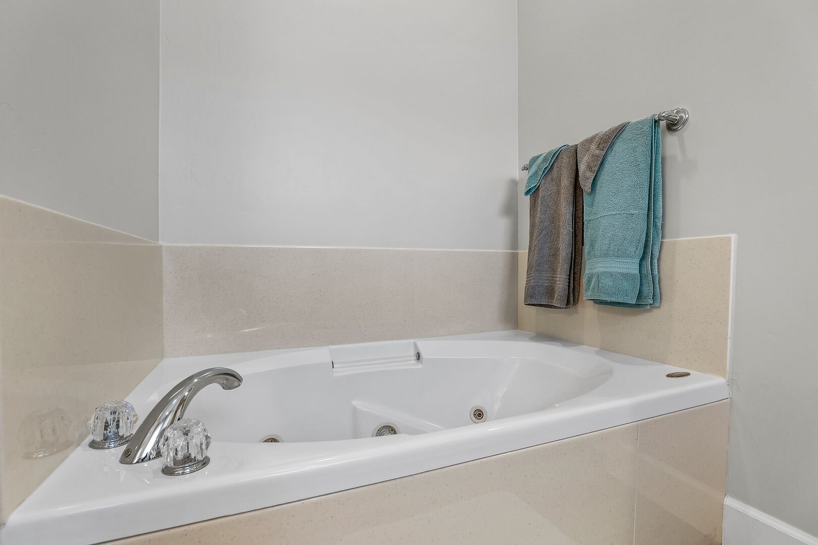 Primary en-suite bathroom on the 1st Floor with a whirlpool spa, walk-in shower, double vanities, and a separate commode room.