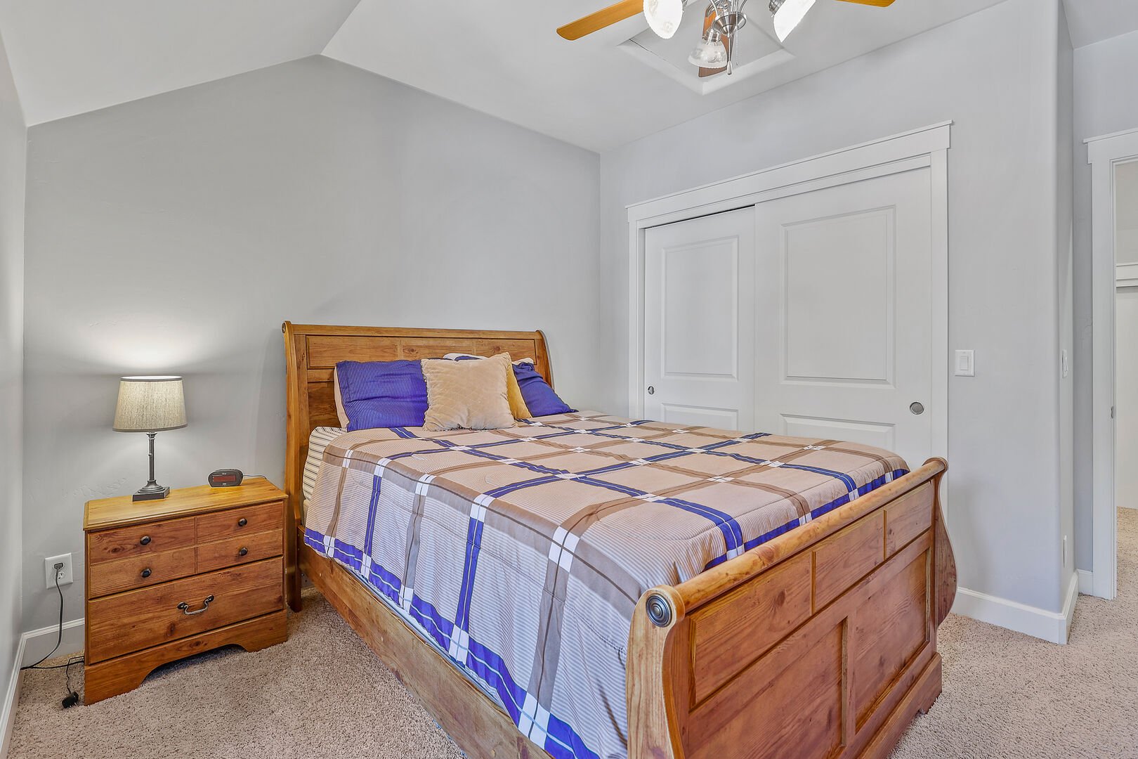 Guest Bedroom 2 - 2nd Floor: Queen bed with a memory foam topper, cable TV, two dressers, and an end table.