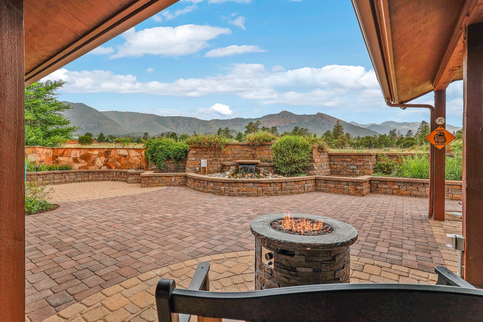 Unwind beneath a honeysuckle-draped pergola, gather around the firepit, enjoy the soothing sounds of a seasonal fountain, or savor meals prepared on the barbecue grill.