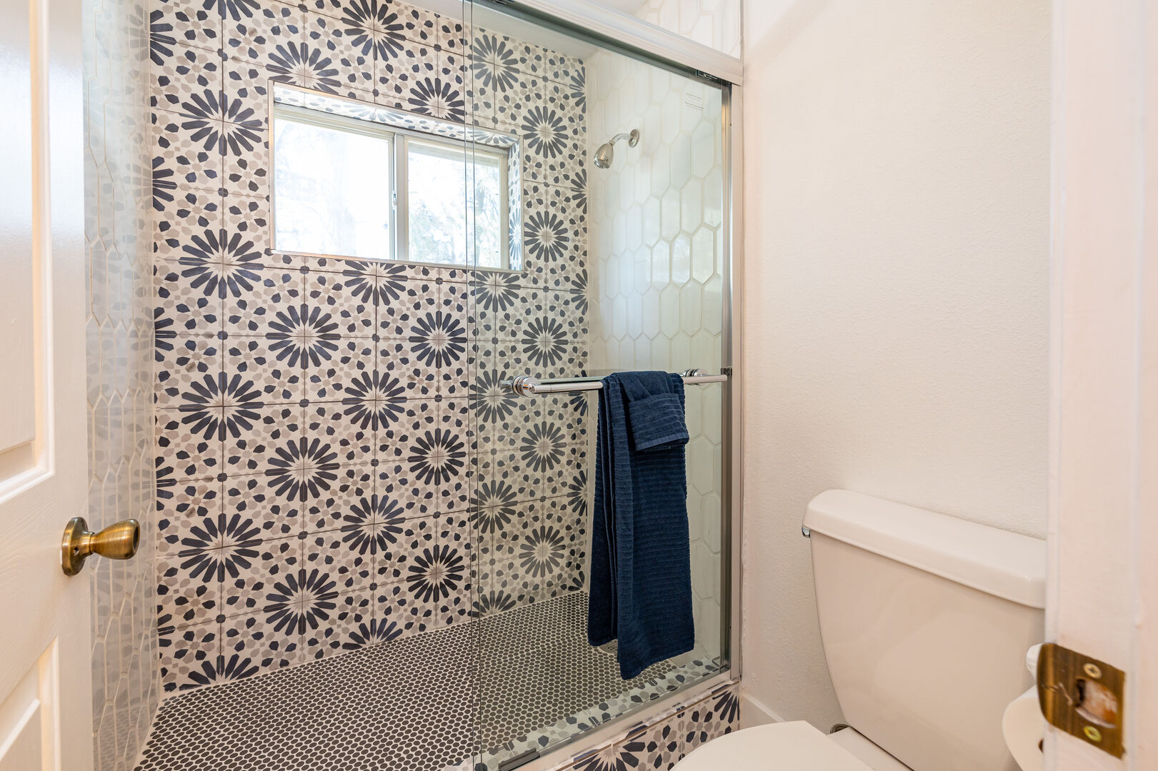 a beautiful tiled walk-in shower
