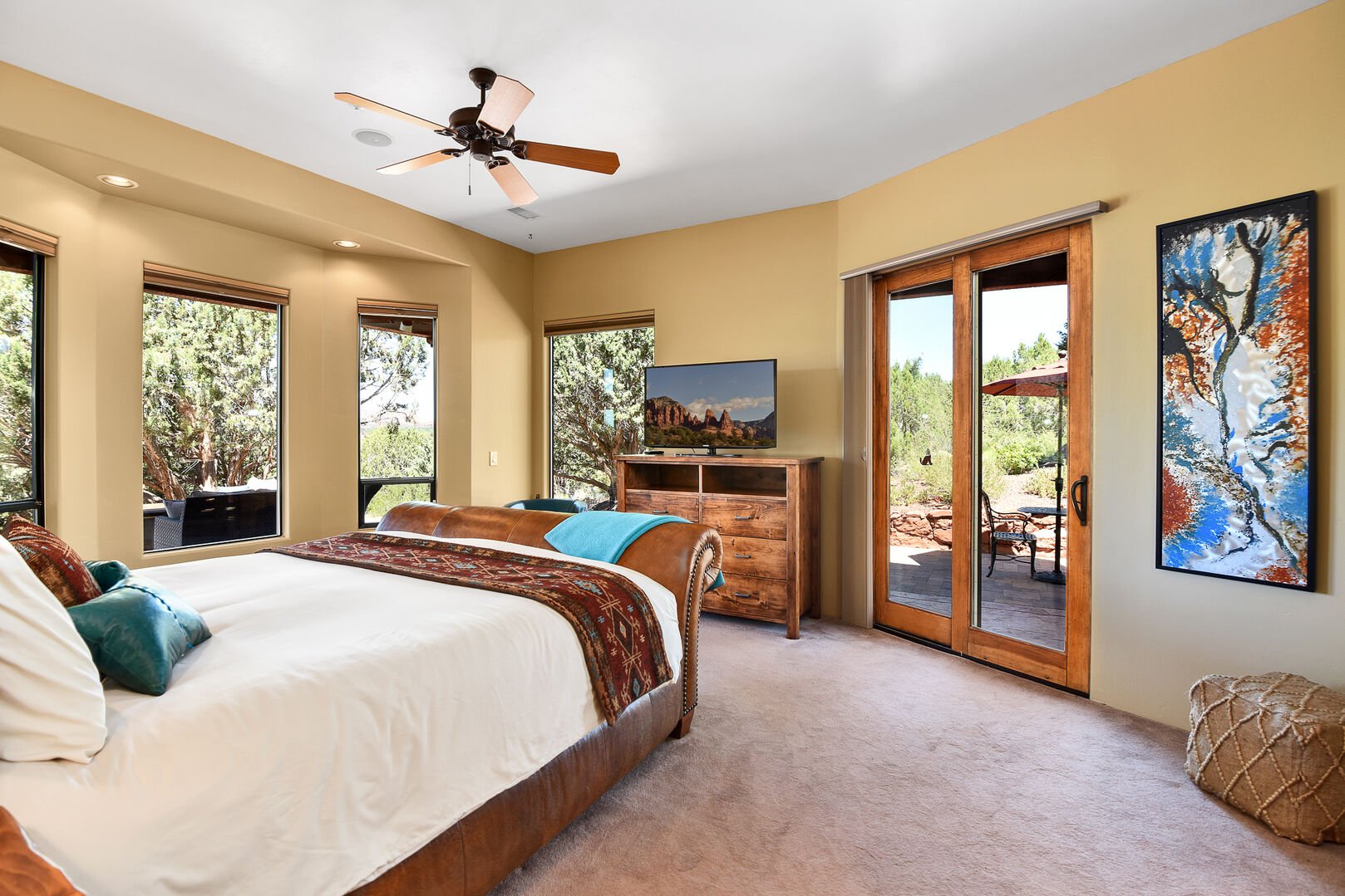 Master Suite: King bed, two-sided fireplace, soaking tub, sliding glass doors leading to outdoor spaces, and an en-suite bathroom with double vanity, soaking tub and walk-in shower.
