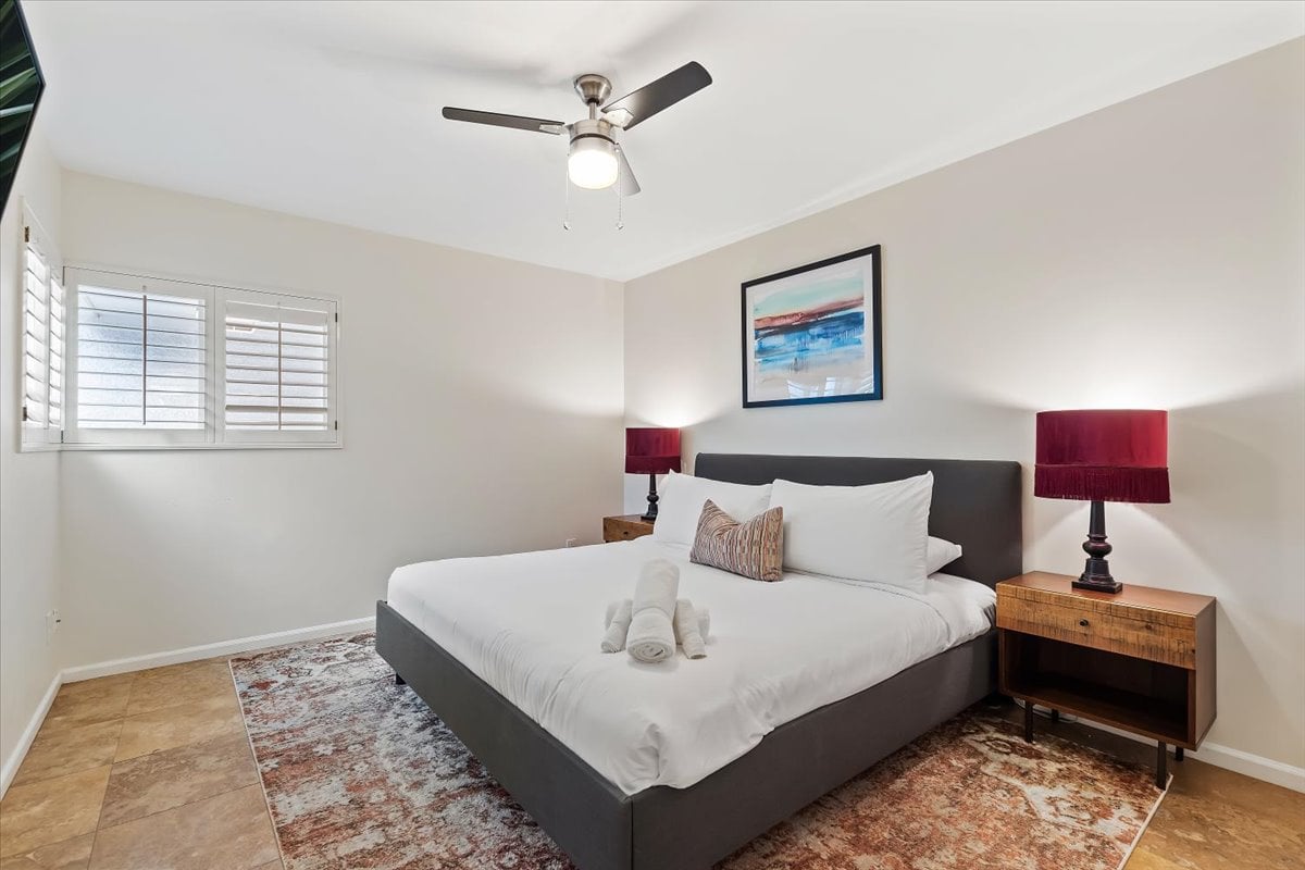 4th bedroom with a King bed, smart TV and closet space.