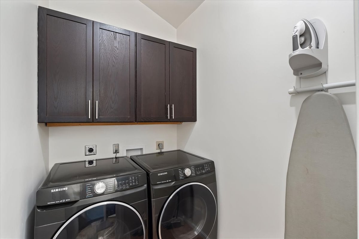 Half bathroom, with a washer and dryer for your convenience.