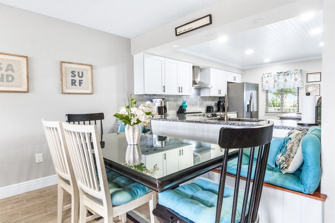 Dining area with seating for six, adjacent to the living room.
