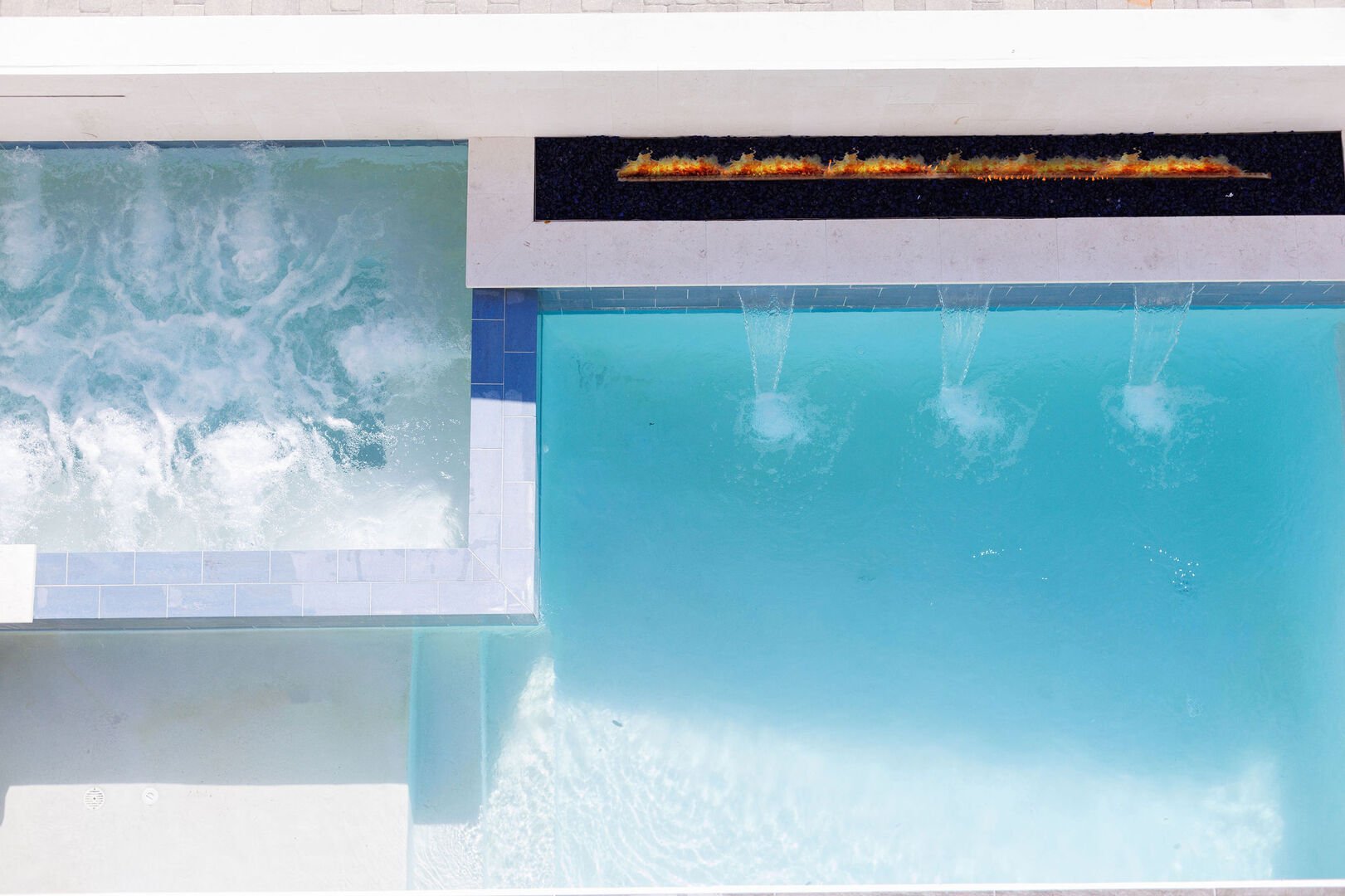Home features a private pool, sitting spa and fireplace.