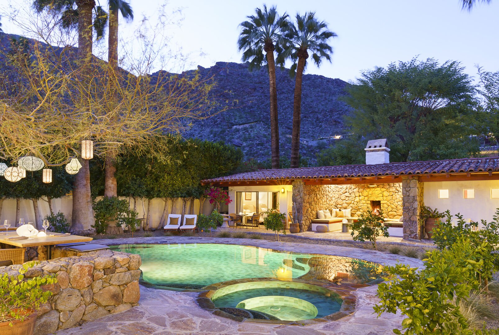 The pool and spa are lit up for a night swim