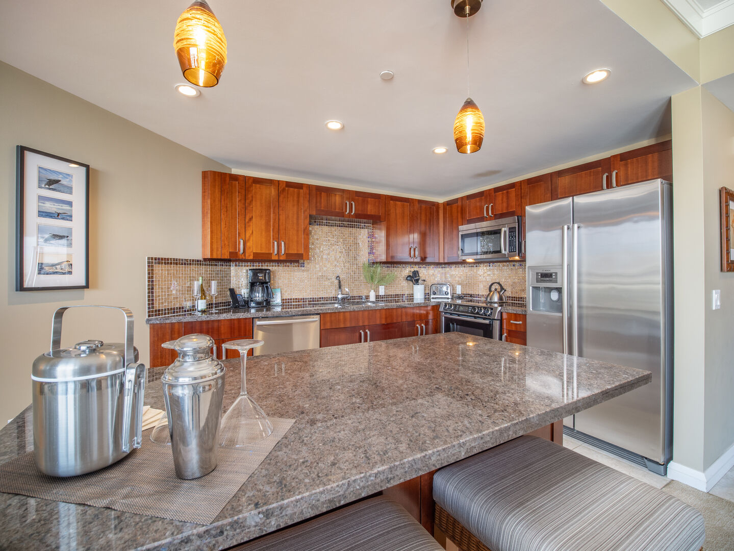 Enjoy casual meals or mix cocktails on the granite island, perfectly situated in this modern kitchen.