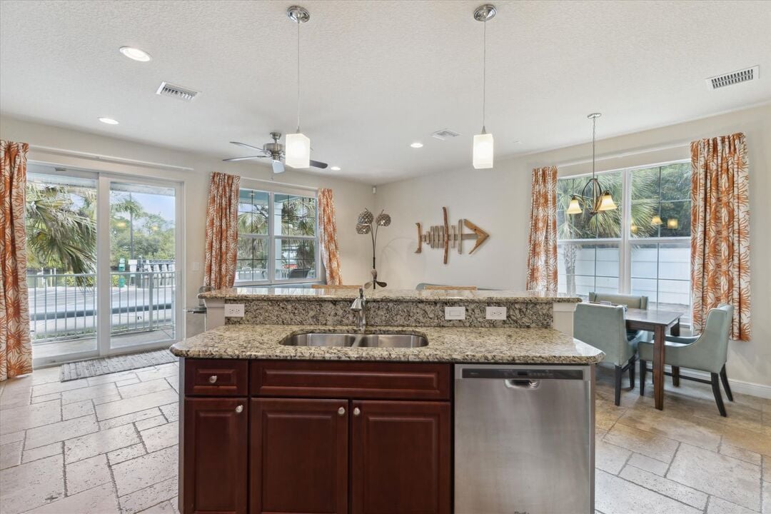 Prep meals while staying connected with everyone and taking in the beautiful scenery through expansive windows!