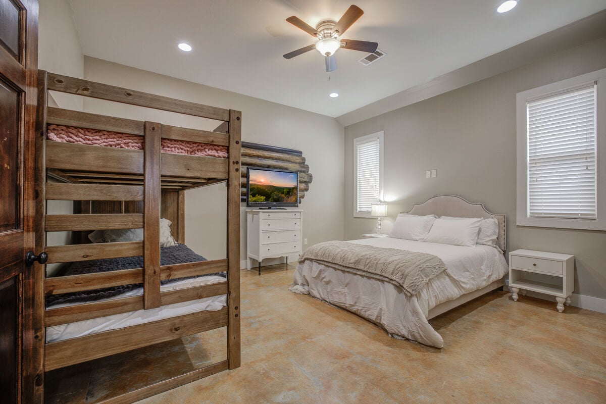A cozy bedroom featuring bunk beds, perfect for kids or extra guests.