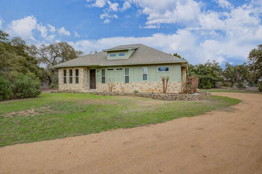 Charming home on three private acres with peaceful surroundings and open skies for a relaxing getaway.