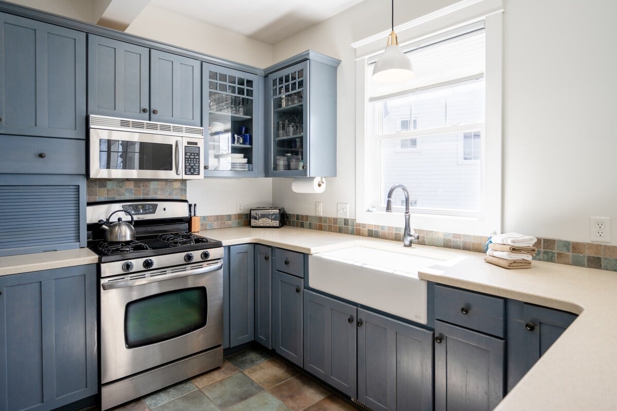 A fully equipped kitchen with stainless appliances and an island