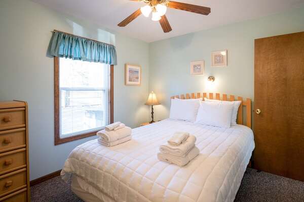 Primary bedroom with a queen bed and attached bath.