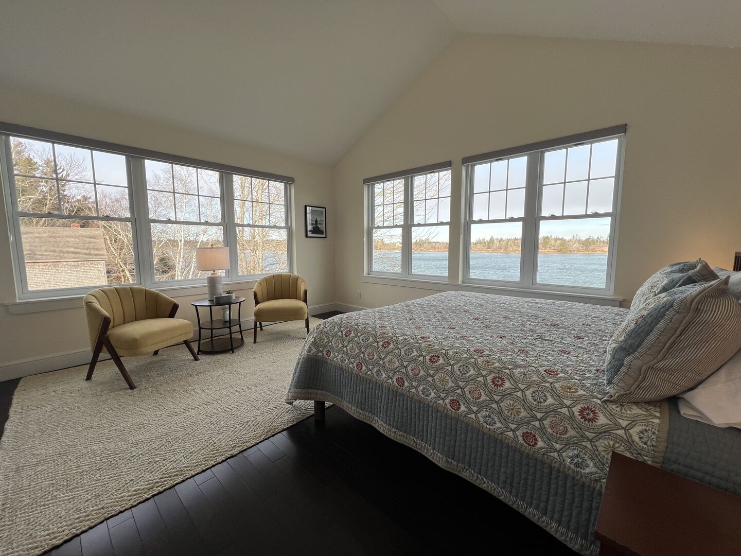 The primary bedroom boasts tall cathedral ceilings, a comfortable sitting area and stunning ocean views that can not be beat.