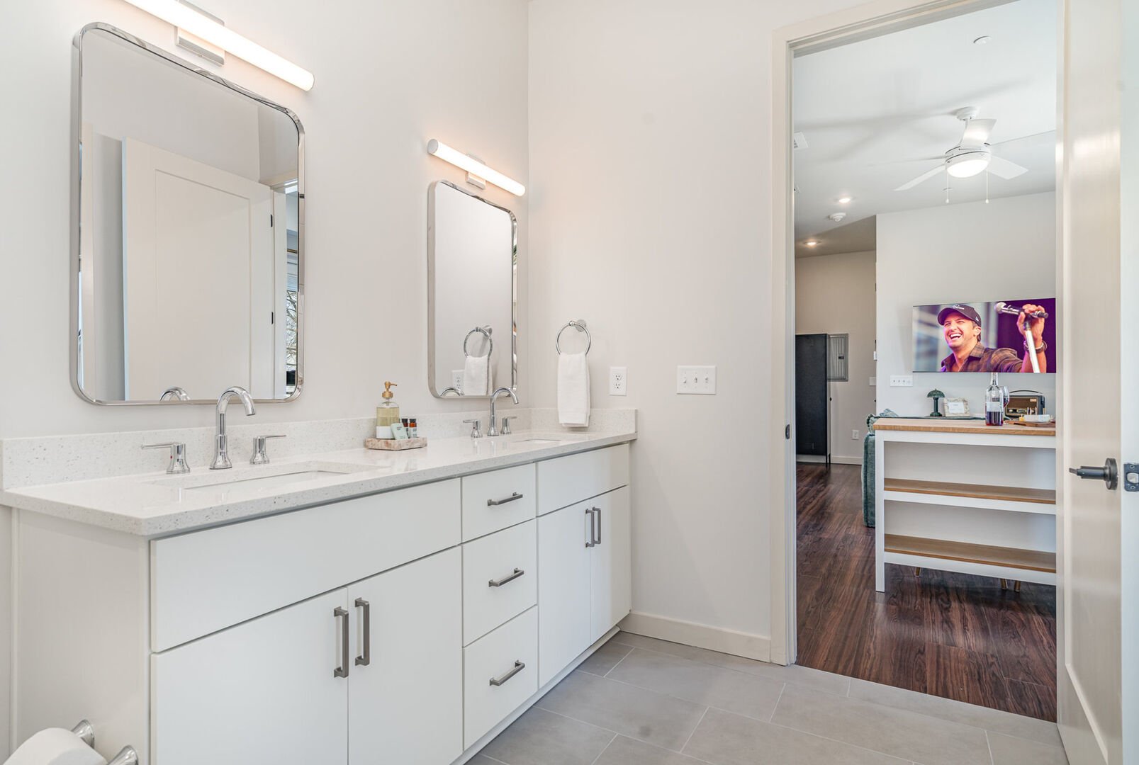 Primary Jack and Jill Bathroom with a double vanity and shower/tub combo, seamlessly connecting the primary bedroom to the main living area.