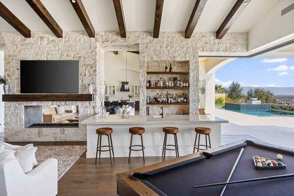 Practice your mixology skills from the bar area or spark competition from the pool table.