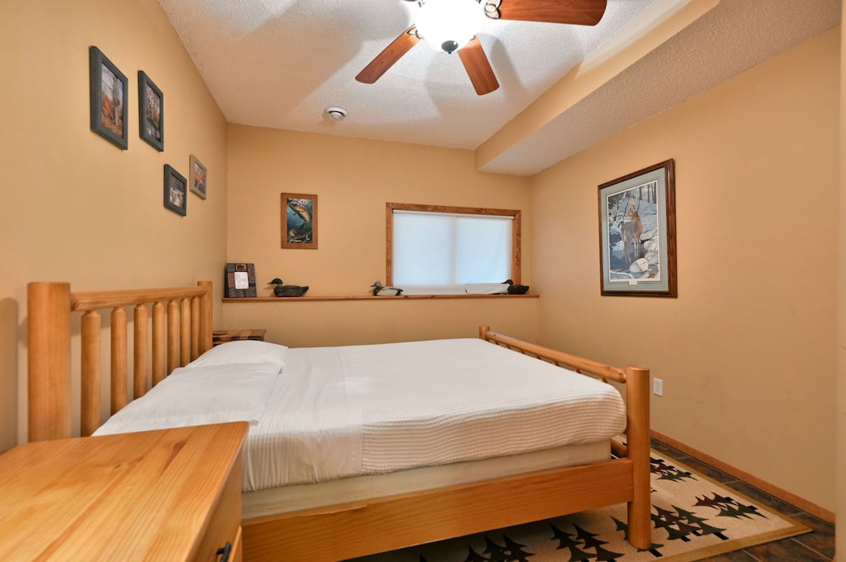 Bedroom 3 on the lower level stays cooler in the Summer and also has a window and ceiling fan for additional ventilation.
