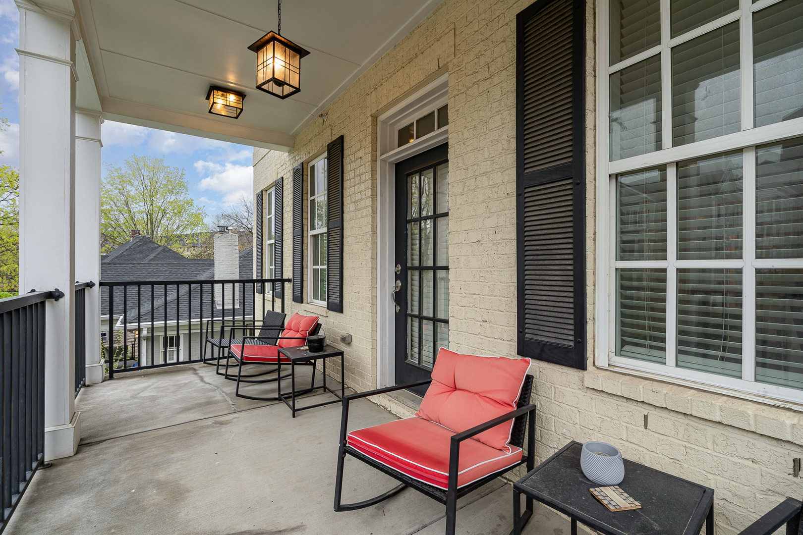 Unit 2 (2nd Floor): Private balcony with outdoor seating.