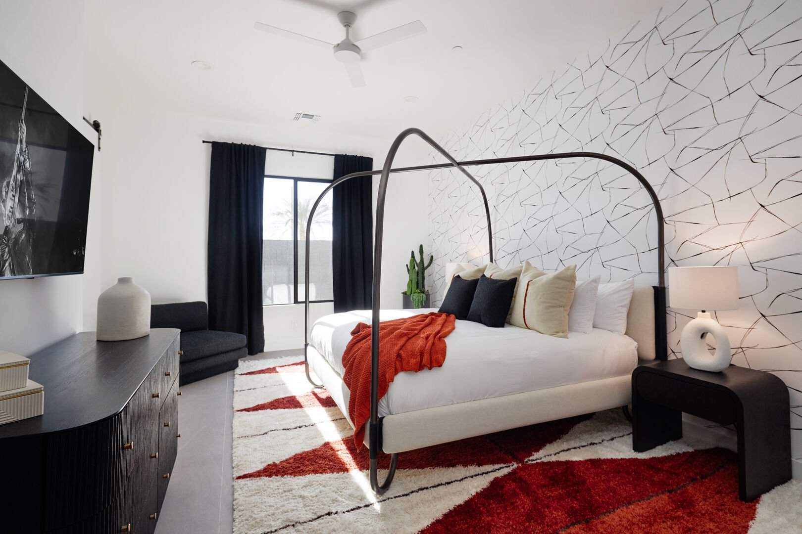 Unit 2: 2nd Primary suite - with King bed, smart TV, walk-in closet, designer furnishings, and en-suite bathroom.