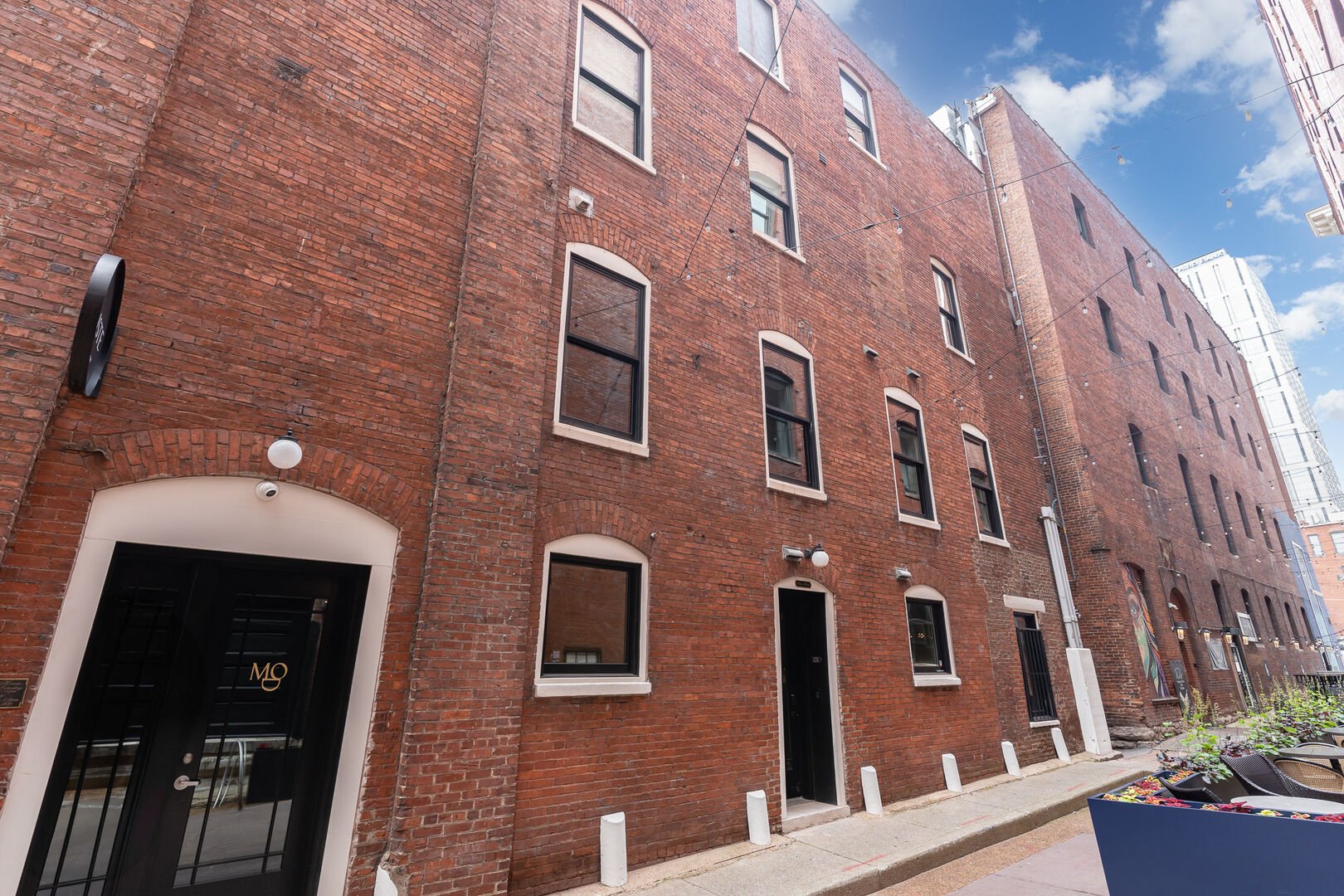 Exterior view of the building. Entrance to the home is in Banker's Alley.